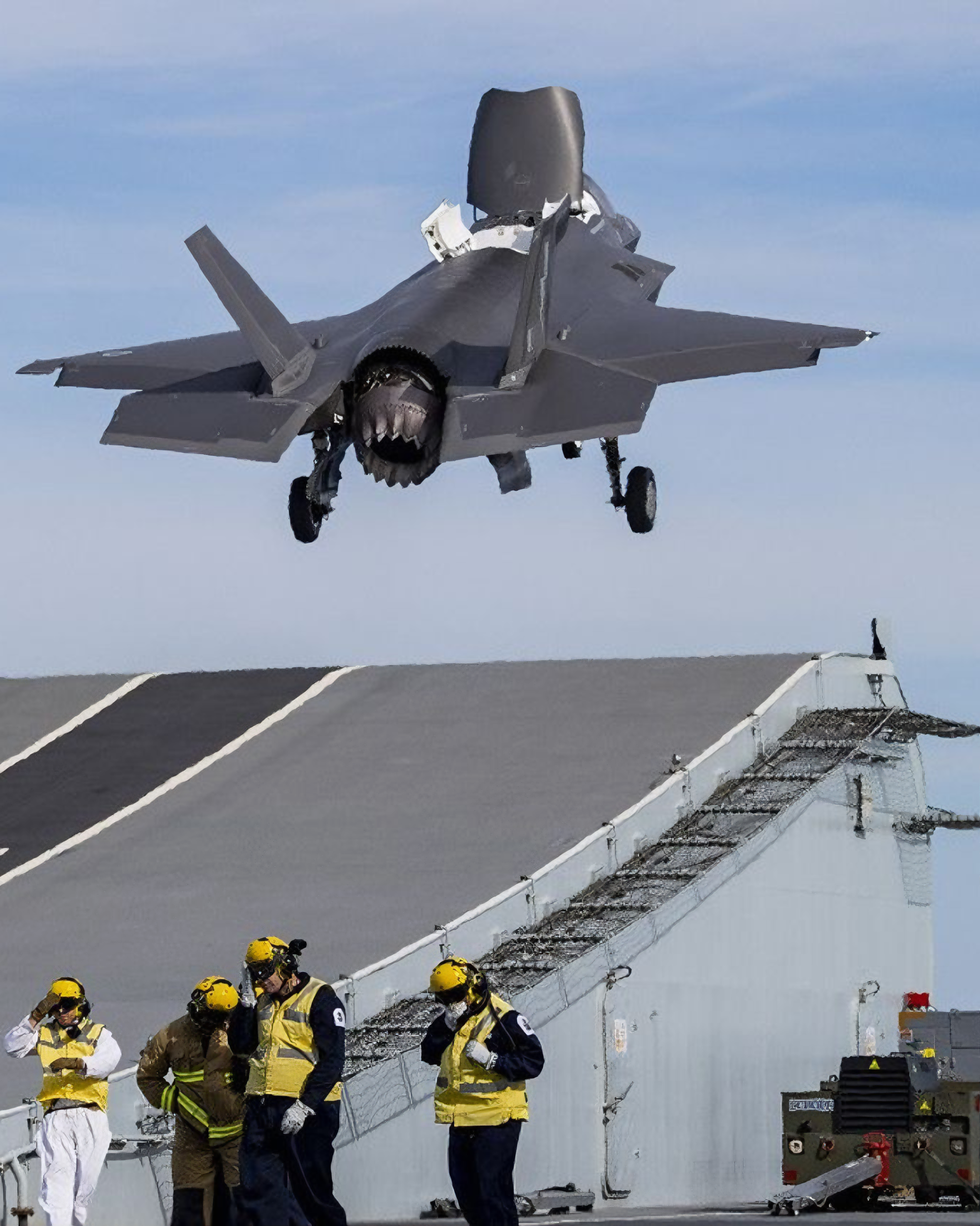 An F-35B Lightning II launches from HMS Queen Elizabeth as Royal Navy sailors look on