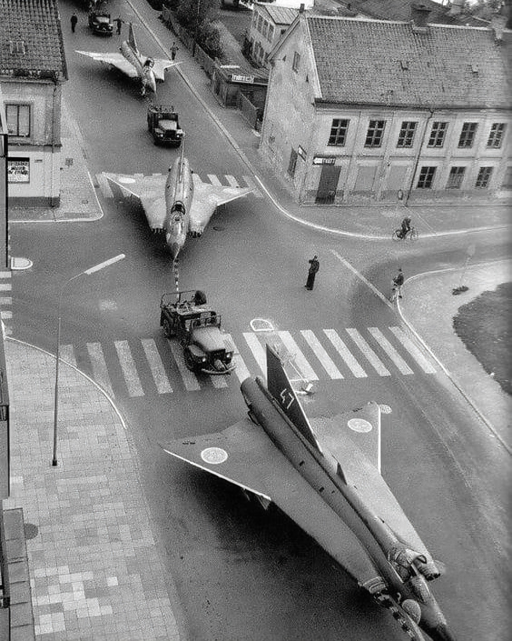 Swedish Saab 35 Draken fighter jets being towed through a city street